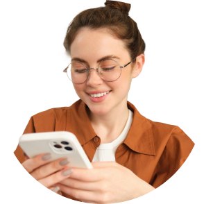 Woman in glasses using her phone at home