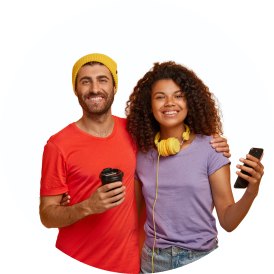 Couple drinking coffee and using a phone